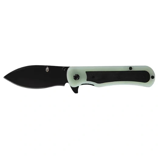 Folding knife with black blade and light green handle on a white background